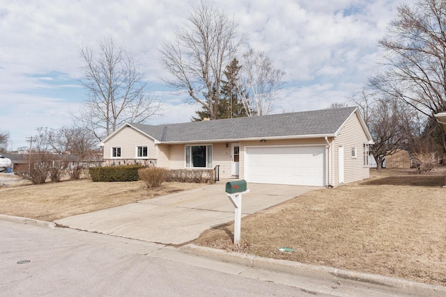 ranch-style home featuring a front lawn, an attached garage, concrete driveway, and roof with shingles