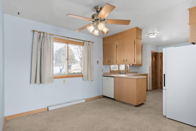 kitchen with light floors, white appliances, light countertops, baseboards, and baseboard heating