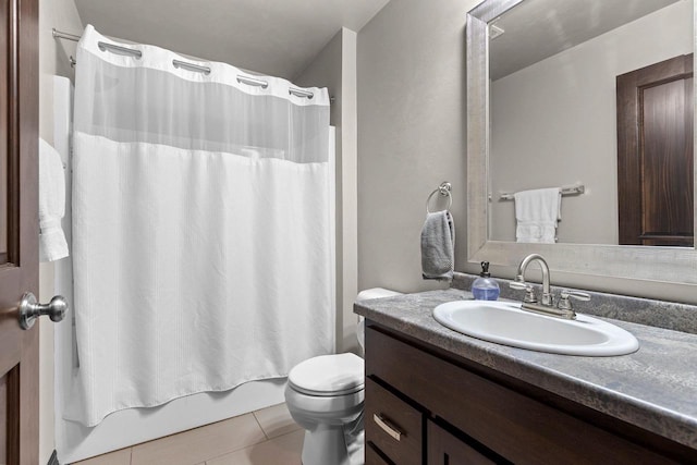 bathroom featuring toilet, shower / bath combination with curtain, vanity, and tile patterned flooring