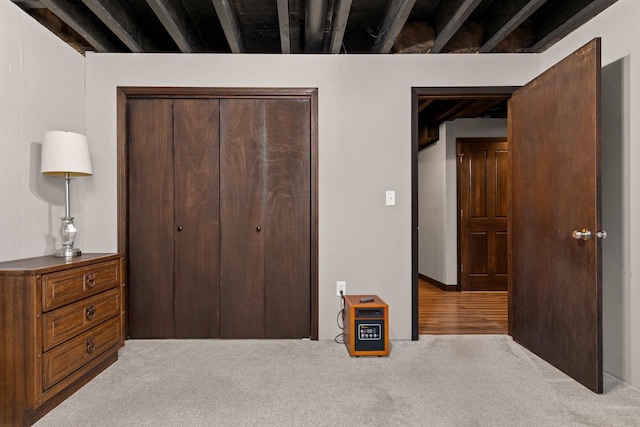 bedroom featuring carpet and a closet