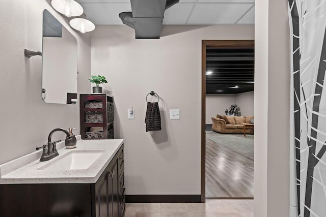 bathroom featuring vanity and baseboards