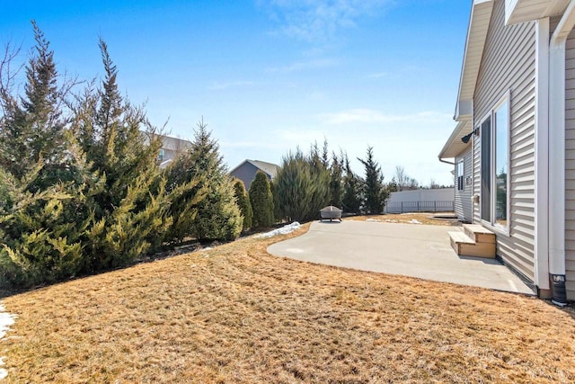 view of yard featuring a patio and fence