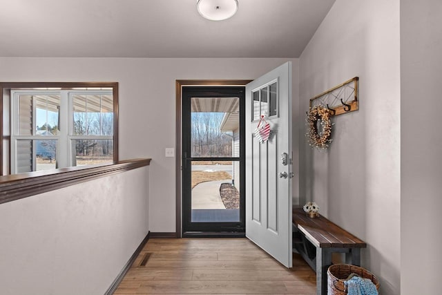 entryway with visible vents, baseboards, and light wood-style floors