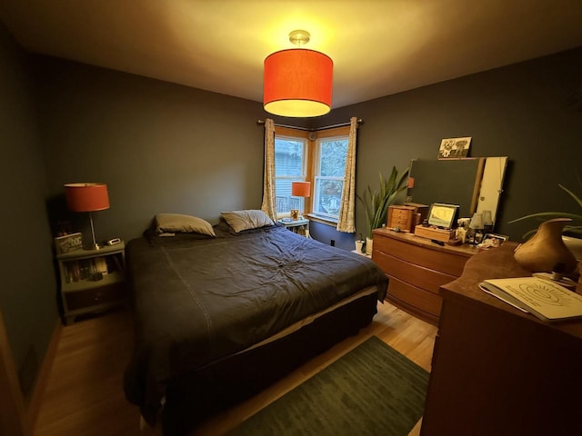 bedroom featuring wood finished floors