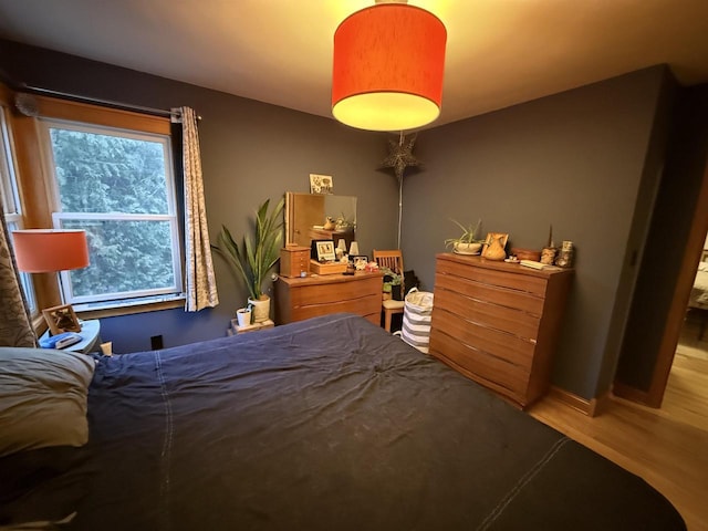 bedroom featuring wood finished floors