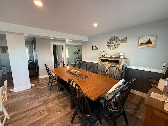 dining area with recessed lighting, baseboards, and wood finished floors