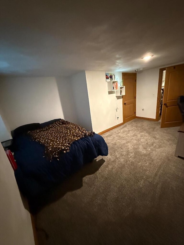 carpeted bedroom with baseboards