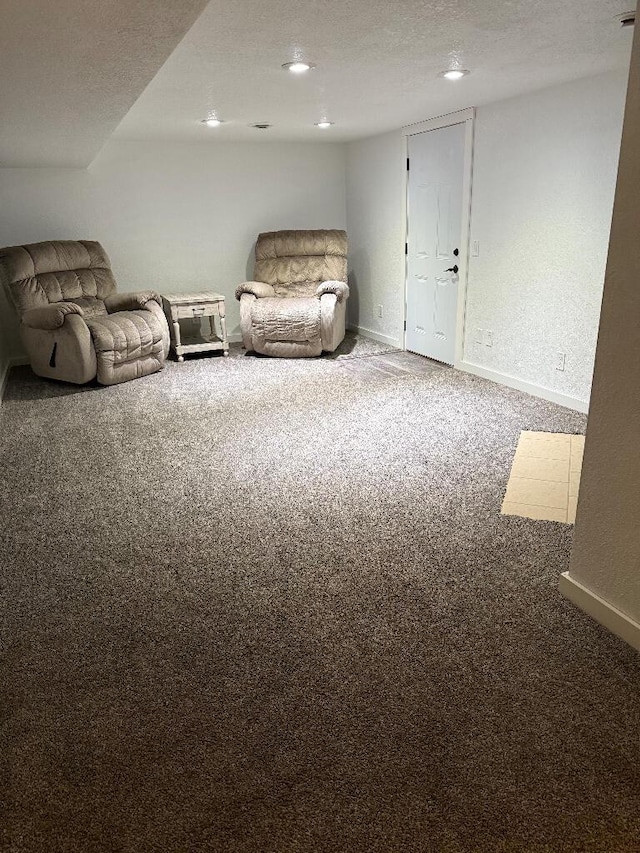 unfurnished room featuring recessed lighting, baseboards, carpet, and a textured ceiling