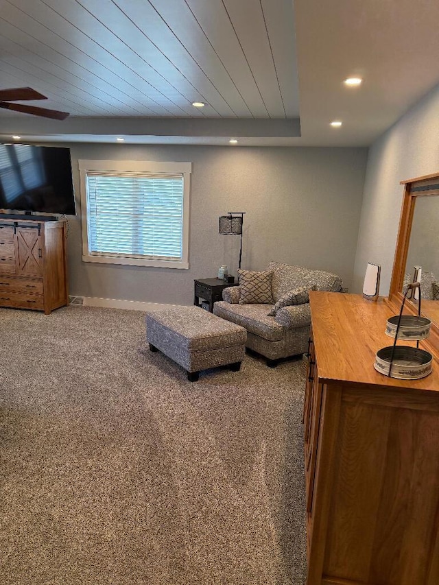 living room featuring recessed lighting, wood ceiling, and carpet