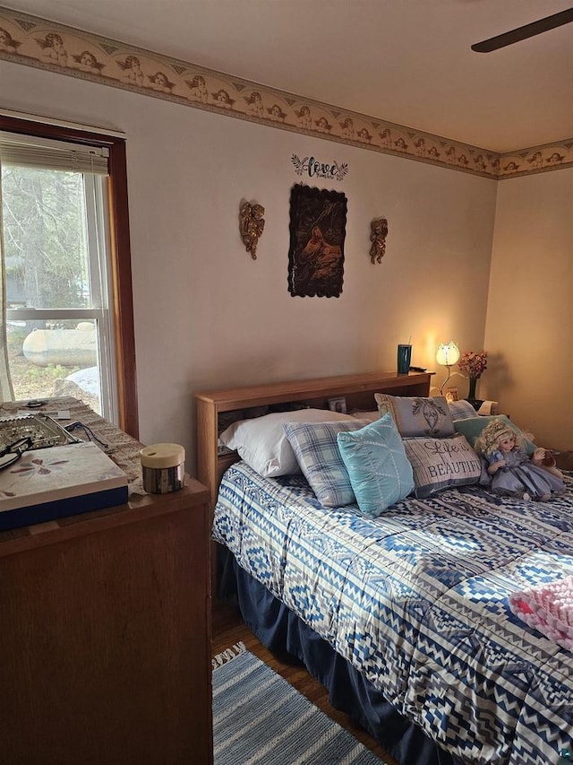 bedroom featuring wood finished floors