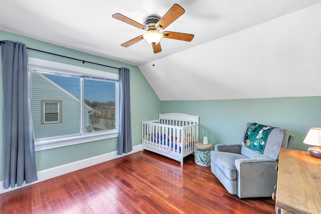 bedroom featuring vaulted ceiling, ceiling fan, baseboards, and hardwood / wood-style floors