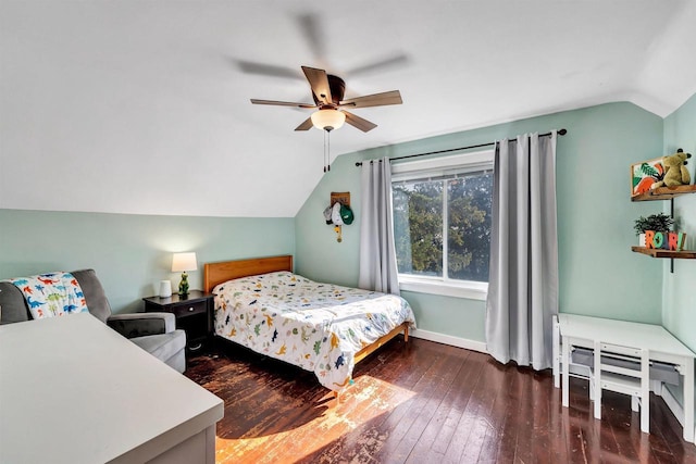 bedroom featuring baseboards, wood-type flooring, ceiling fan, and vaulted ceiling