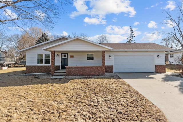 ranch-style home featuring brick siding, an attached garage, and driveway