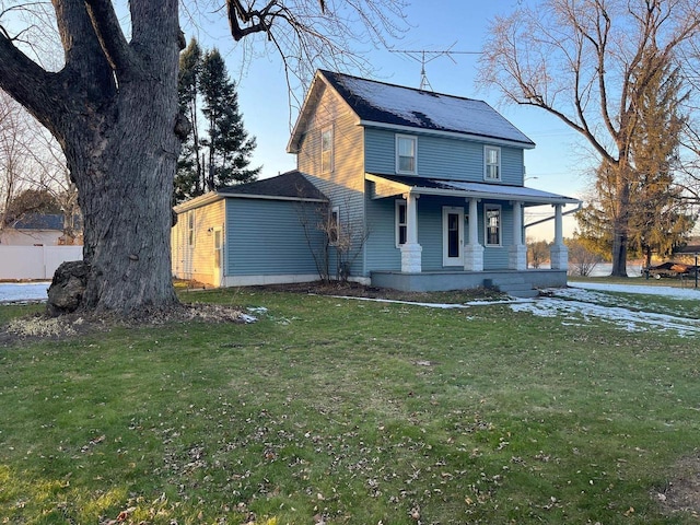 view of front of house featuring a front yard and a porch