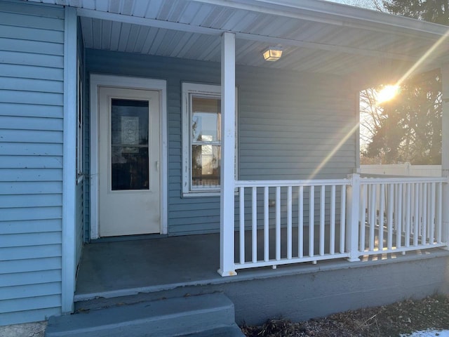 doorway to property with covered porch