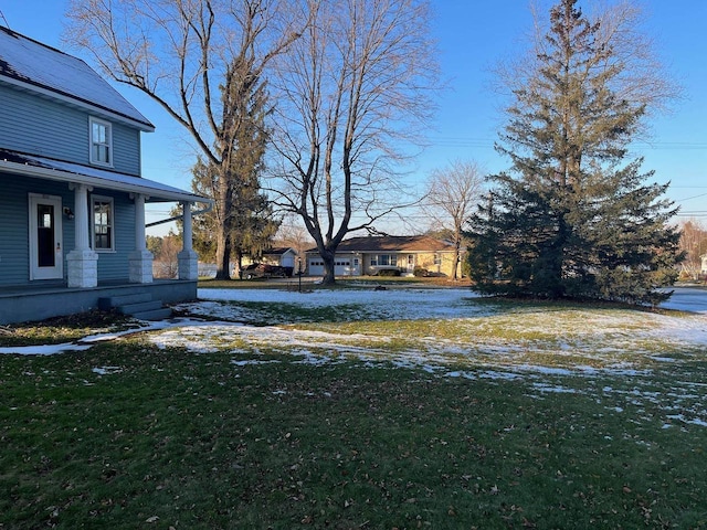 view of yard with covered porch