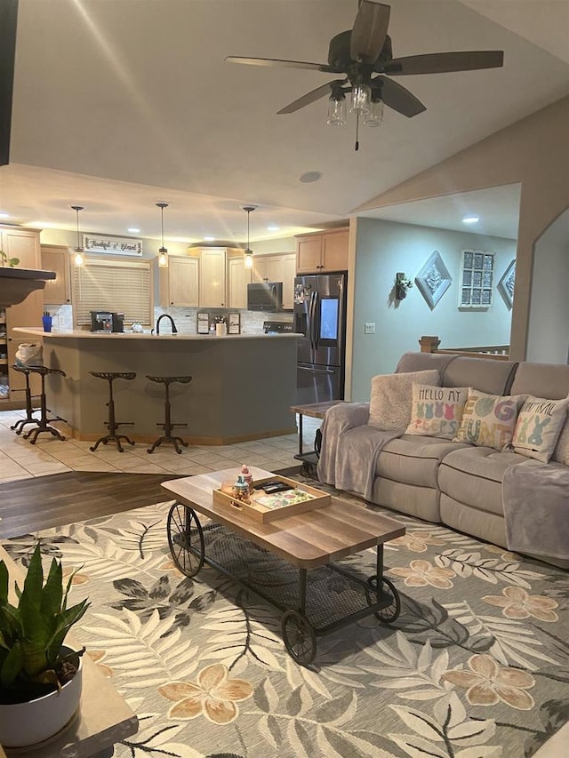 living area with light wood-style flooring and ceiling fan