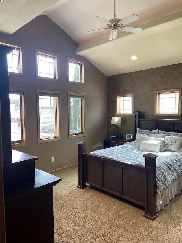 bedroom featuring baseboards, multiple windows, light carpet, and lofted ceiling