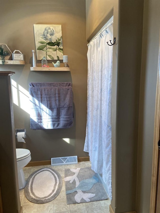 full bath with tile patterned flooring, visible vents, toilet, and baseboards