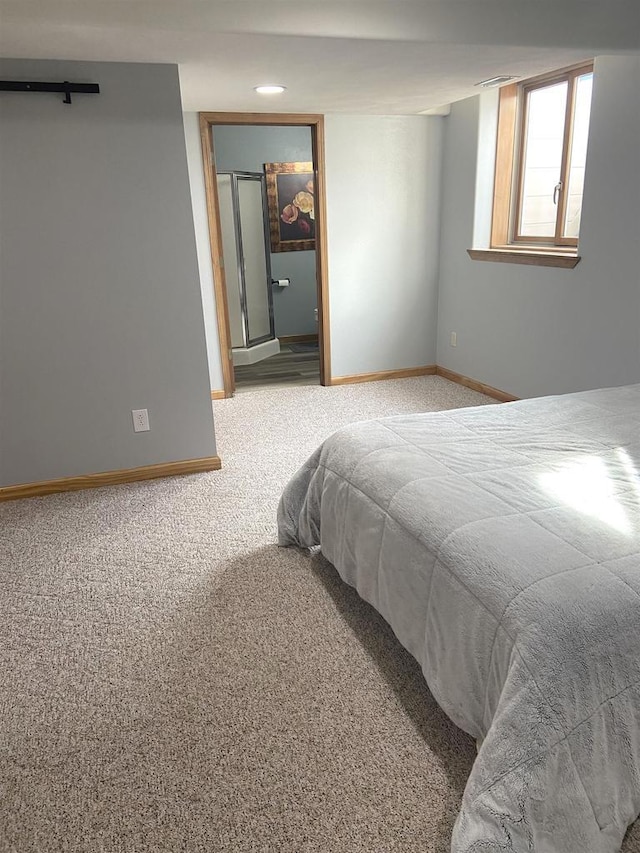 bedroom featuring baseboards and carpet