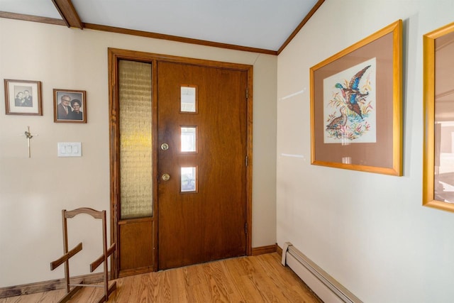 foyer with baseboards, light wood-type flooring, baseboard heating, and ornamental molding