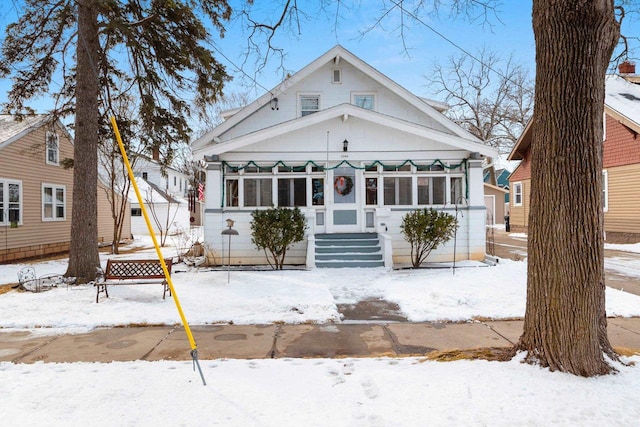 view of front facade featuring a sunroom