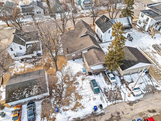 snowy aerial view featuring a residential view