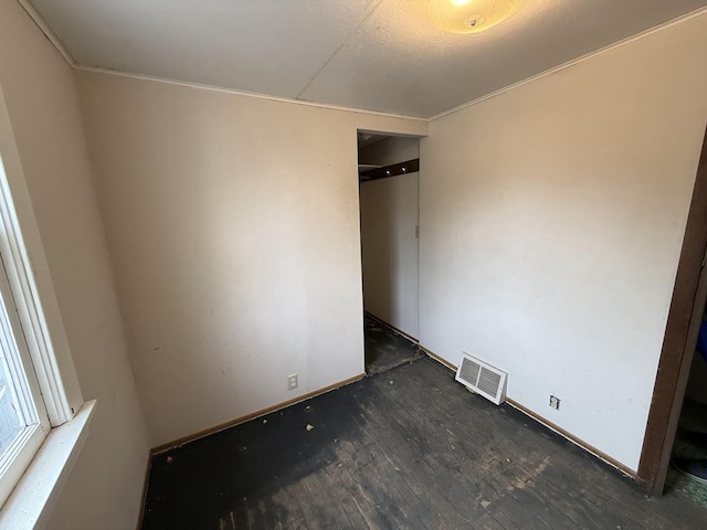 unfurnished bedroom featuring visible vents