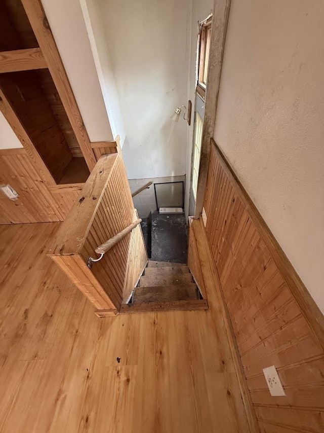 stairway with wood finished floors