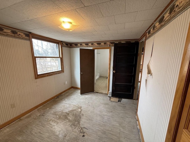 unfurnished bedroom featuring baseboards