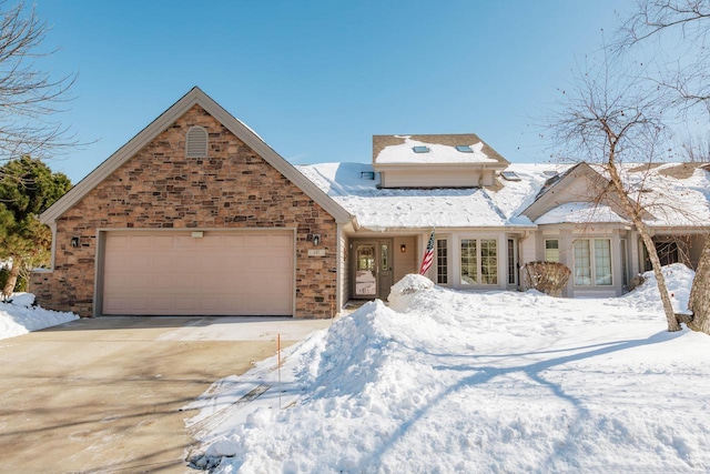 view of front of home featuring a garage and driveway