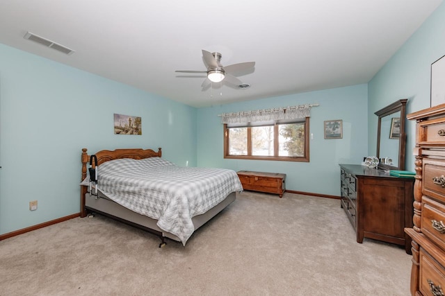 bedroom featuring light carpet, visible vents, and baseboards