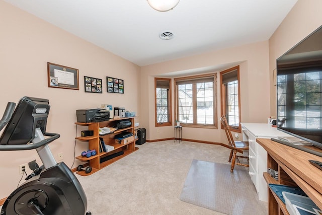 carpeted home office with visible vents and baseboards