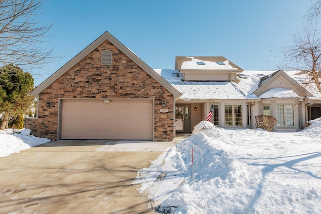 view of front of property with an attached garage and driveway