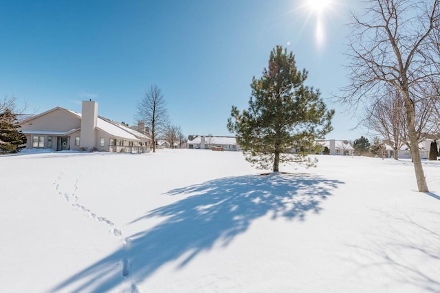 view of yard layered in snow