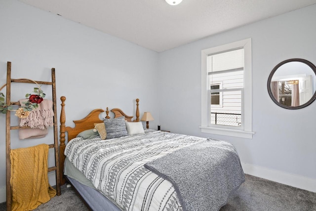 bedroom with baseboards and carpet flooring