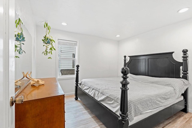 bedroom with recessed lighting, baseboards, and light wood-style floors