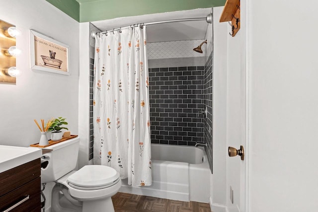 full bath featuring vanity, shower / tub combo, and toilet