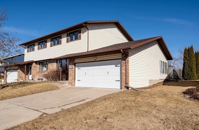 view of front of property featuring concrete driveway, a garage, and brick siding