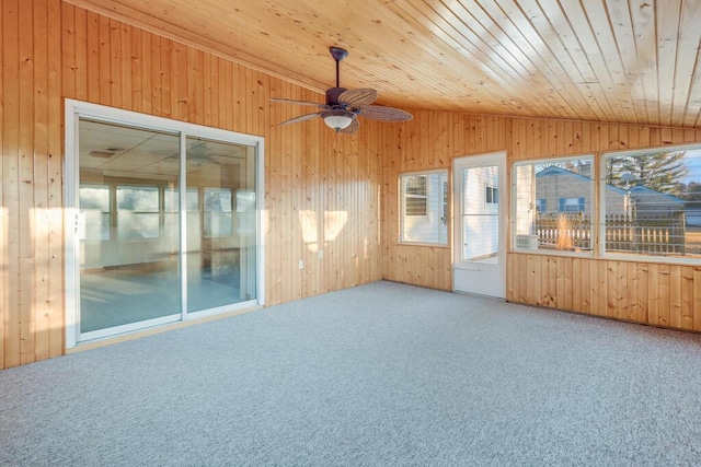 unfurnished sunroom with a ceiling fan, lofted ceiling, and wood ceiling