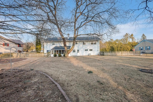 rear view of house with fence