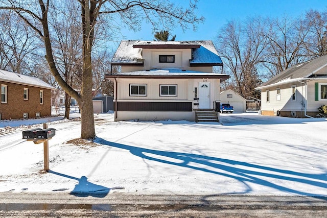 view of front of house featuring an outbuilding and a detached garage