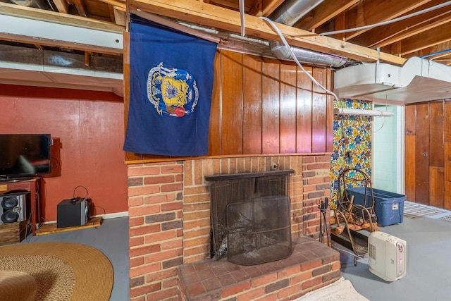 interior space featuring concrete flooring and a fireplace