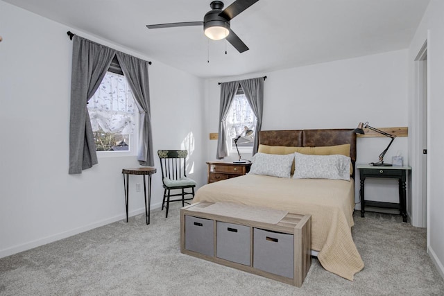 bedroom with baseboards, light colored carpet, and a ceiling fan