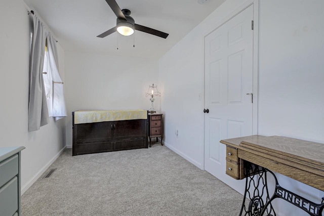 carpeted bedroom featuring baseboards, visible vents, and ceiling fan