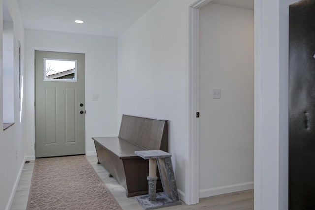 interior space featuring recessed lighting, light wood-style flooring, and baseboards