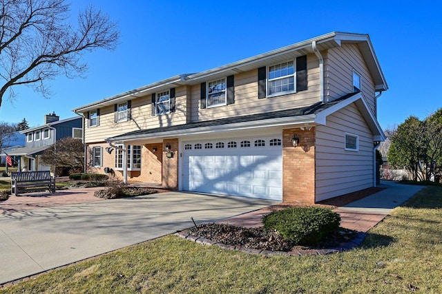 traditional home with brick siding, an attached garage, and driveway