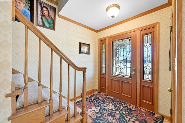 entryway featuring baseboards, ornamental molding, and wallpapered walls