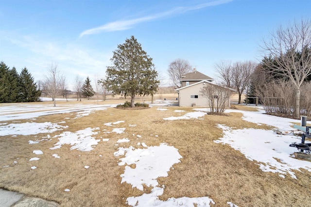 view of yard covered in snow