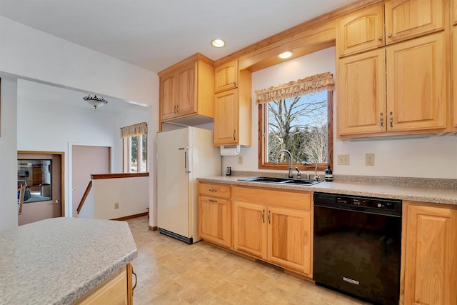 kitchen featuring a sink, black dishwasher, light brown cabinets, and light countertops